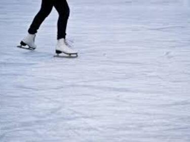 lower half of a person skating on ice