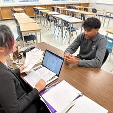 Student being interviewed by teacher