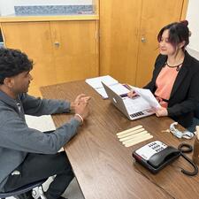 Student being interviewed by teacher