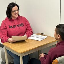 Student being interviewed by teacher