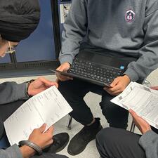 Student working collaboratively on resumes