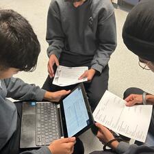 Student working collaboratively on resumes