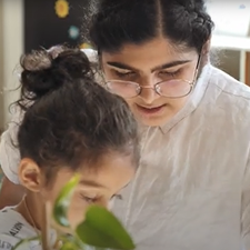 ATS Grad in an early childhood education program interacting with child