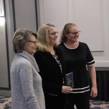 Three Women standing and pose for a photo